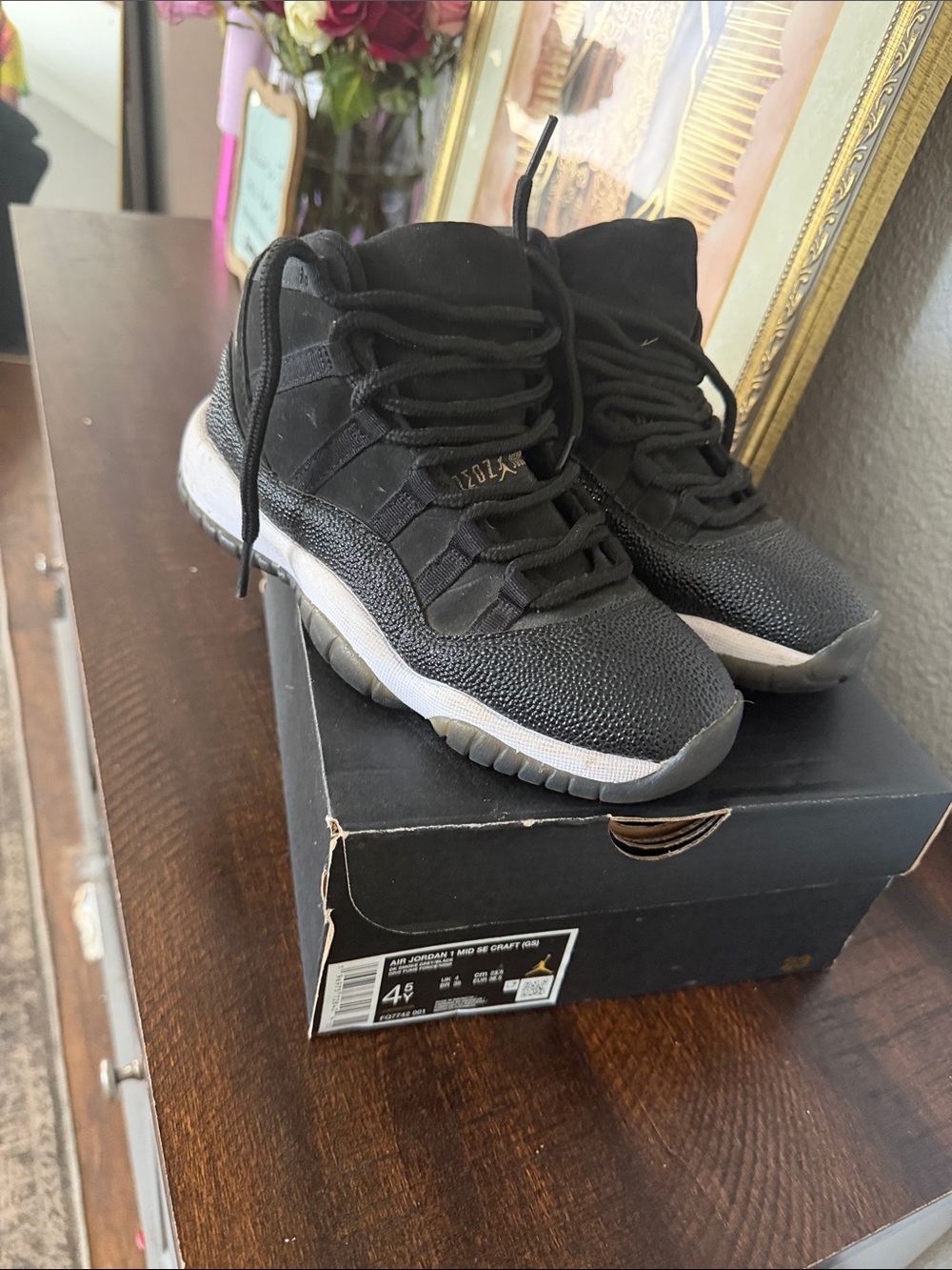 Jordan Black and White High-Top Sneakers with Gold Accents